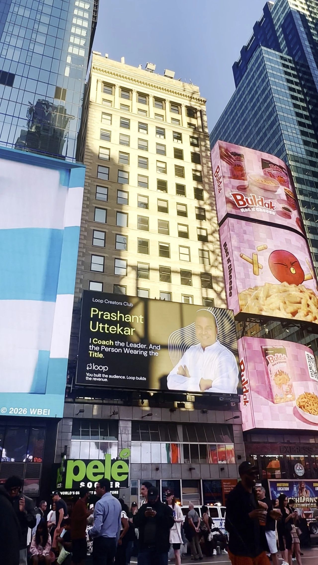 The billboard lit up in the evening over Times Square