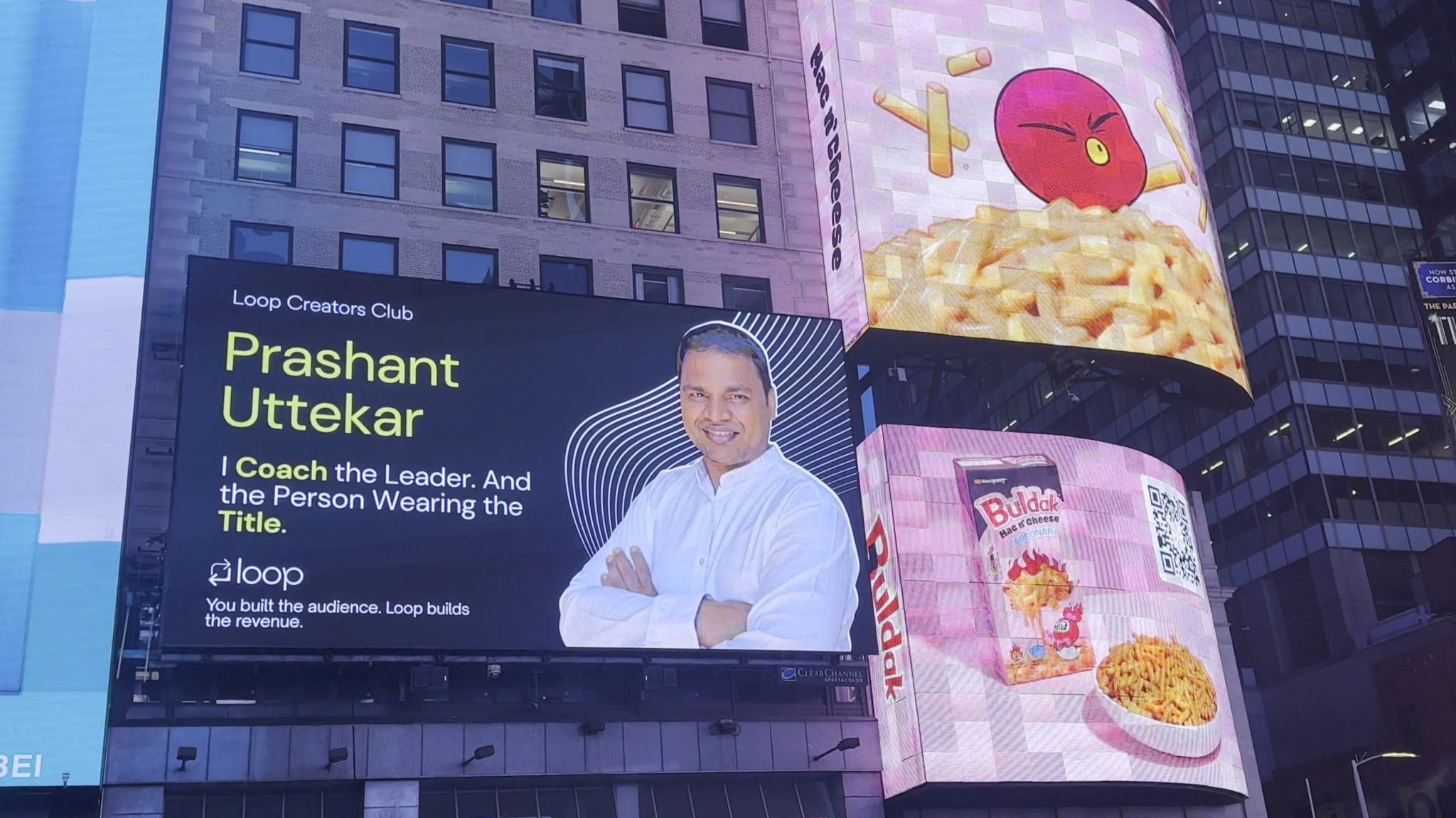 The Times Square billboard above a busy New York street